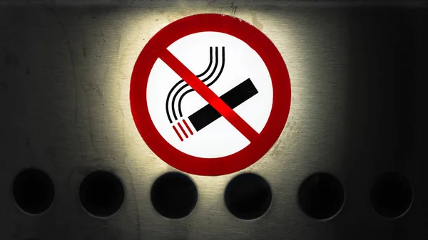 No Smoking sign, cigarette icon on metal surface.