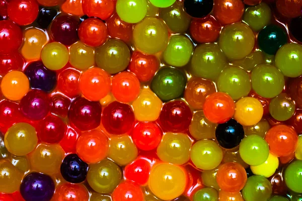 Mágica crescente bolas de geleia coloridas — Fotografia de Stock