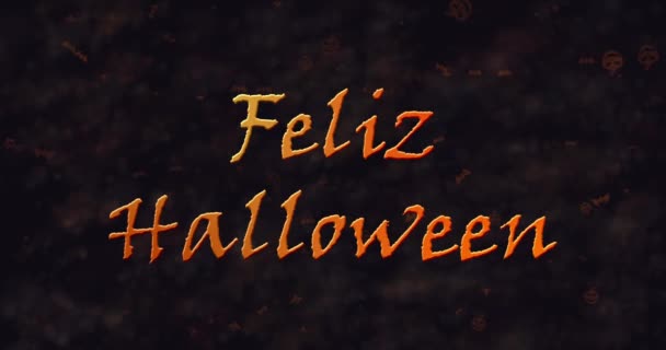 Feliz Halloween text in Spanish dissolving into dust to left — Stock Video