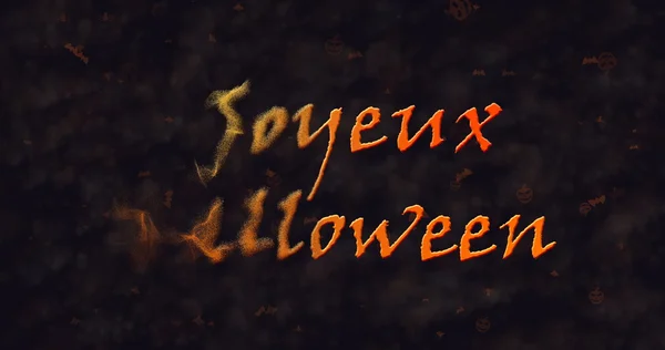 Текст Joyeux на Хэллоуин по-французски растворяется в пыли, чтобы лечь — стоковое фото