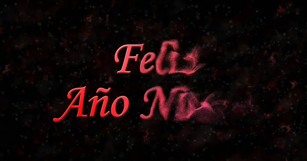 Šťastný nový rok text ve španělštině "Feliz ano nuevo" se změní na prach z přímo na černém pozadí — Stock fotografie
