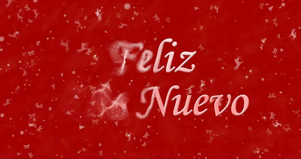 Feliz Año Nuevo texto en español "Feliz ano nuevo" se convierte en polvo de la izquierda sobre fondo rojo — Foto de Stock