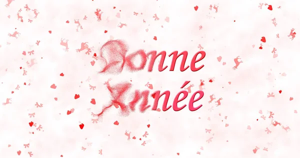 Happy New Year text in French "Bonne annee" turns to dust from left on white background — Stock Photo, Image