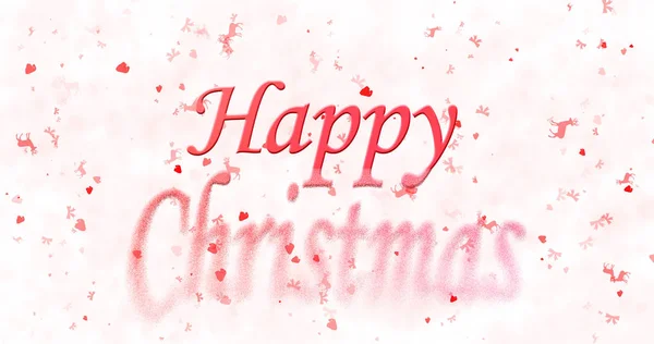 Щасливий різдвяний текст перетворюється на пил знизу на білому тлі — стокове фото