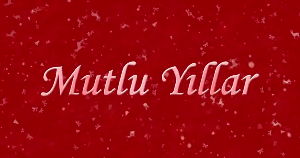 С Новым годом текст на турецком языке "Mutlu Yillar" формируется из пыли и превращается в пыль горизонтально на красном анимированном фоне — стоковое видео