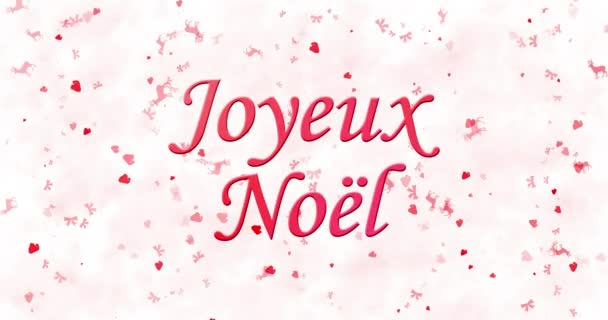 Весёлый рождественский текст на французском языке "Joyeux Noel" превращается в пыль снизу на белом анимированном фоне — стоковое видео