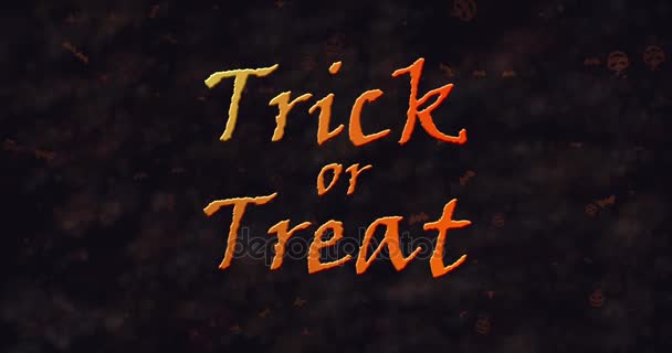 Trick or Treat texto disolviéndose en polvo a la izquierda — Vídeo de stock