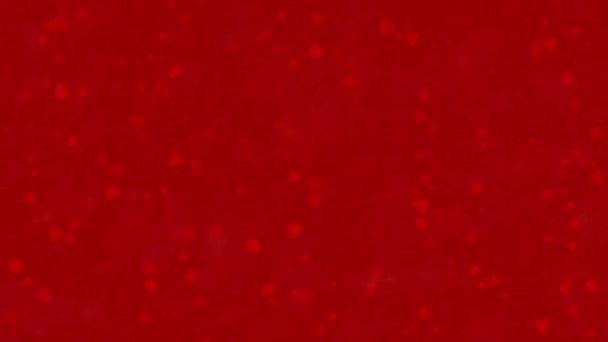 Happy Valentine's Day text in Italian "Buon San Valentino" formed from dust and turns to dust horizontallyon red background — Stock Video