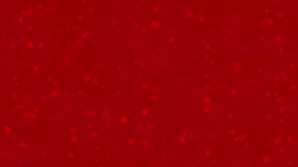 "I Love You" text in German "Ich Liebe Dich" formed from dust and turns to dust horizontally on red background — Stock Video