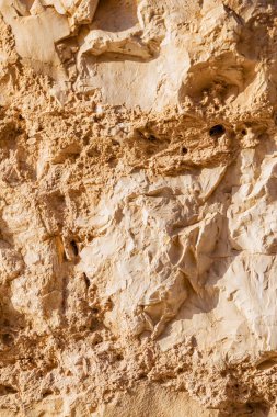 Duvar kumtaşı dokusu. Sarı eski grunge yüzeyi, taş antika kumaş. Gönüllü arkaplan