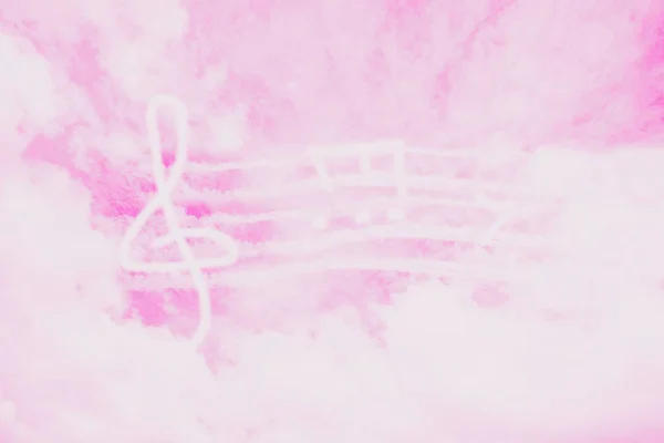 Music in heaven. Music violin clef sign or G-clef or treble clef and notes in the pink sky. Abstract background