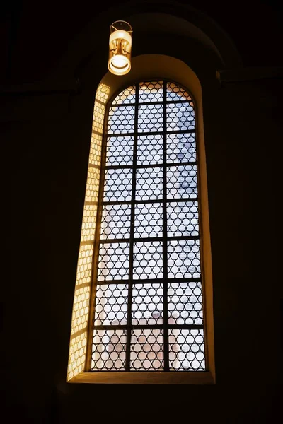 Beautiful window and a lamp in the german catholic church — Stock Photo, Image
