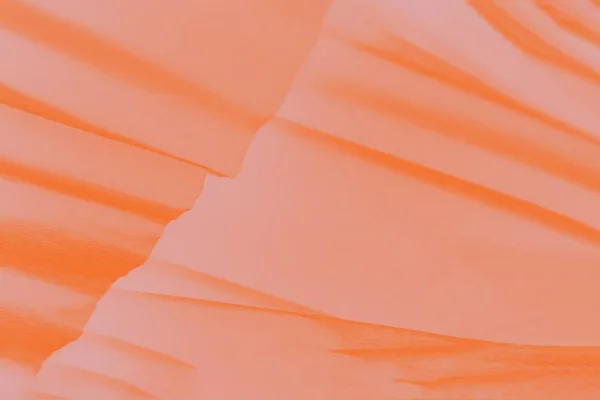 Orange gradient abstract background with paper waves.