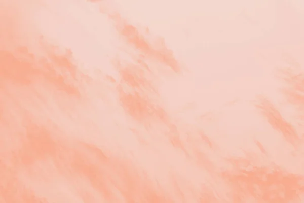 Orange pastel watercolor sky background with soft delicate clouds. Copy space