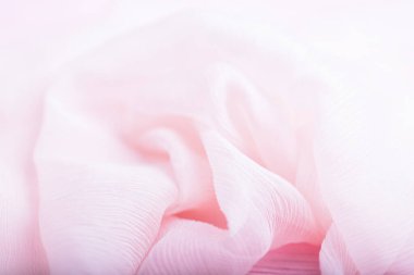 Açık pembe kıvrımlı, akan ipek kumaş arka plan