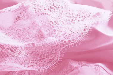 Hassas pastel ipek dantel iç çamaşırı, pembe arkaplan