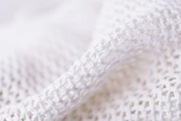 White fabric textile mesh background, knitting background texture