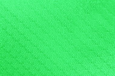 Işık helen zemin üzerinde yeşil eğimli küçük noktalar deseni, soyut