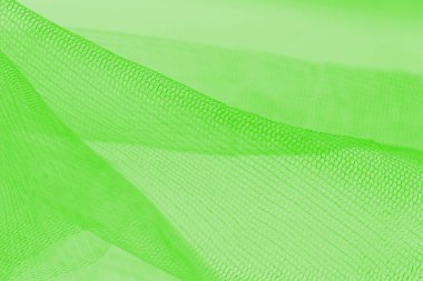 Yeşil arkaplanda hafif küçük örgü kumaşı, yeşilin tonları