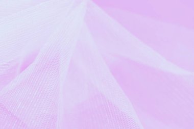 Pembe arkaplanda beyaz küçük örgü kumaşı, kopyalama alanı, soyut bulanık arkaplan