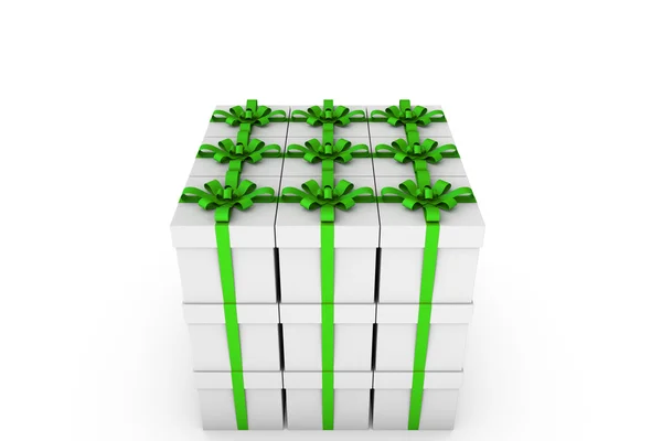 White gift boxes with green ribbon bow — Stock Photo, Image