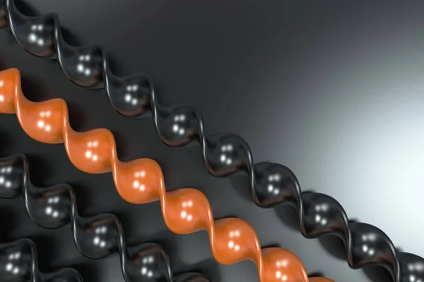 Preto e laranja plástico espiral varas no fundo preto — Fotografia de Stock