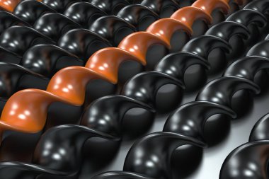 Siyah arka plan üzerine siyah ve turuncu plastik spiral sopa