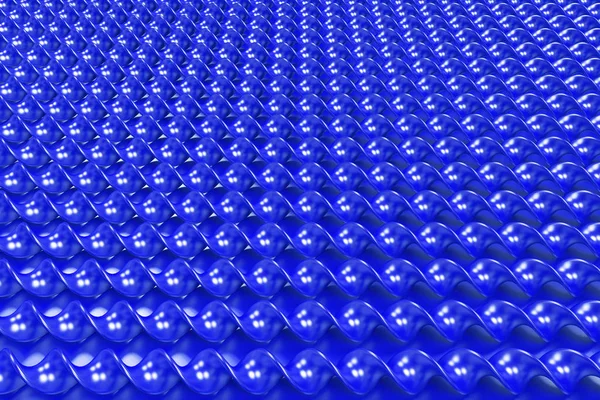Синие пластиковые спиральные палочки на синем фоне — стоковое фото