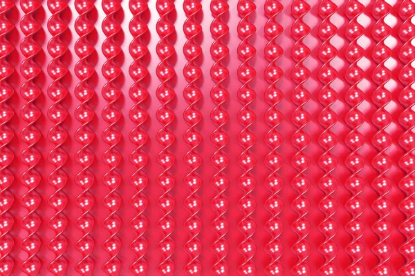 Röd plast spiral pinnar på röd bakgrund — Stockfoto