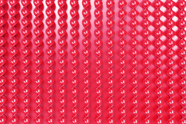 Red plastic spiral sticks on red background