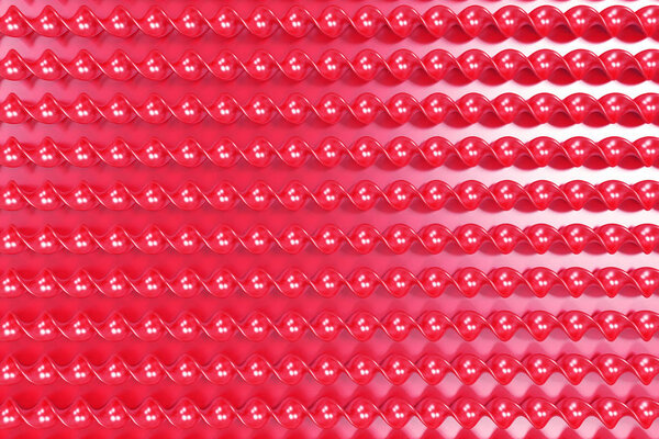 Красные пластиковые спирали на красном фоне
