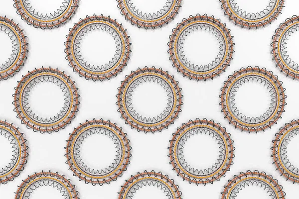 Modèle de formes concentriques en anneaux et spirales sur blanc — Photo