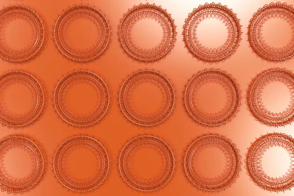 Концентрические формы из колец и спиралей на оранжевом — стоковое фото