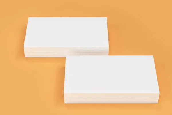 オレンジ色の背景に白の空白の名刺モックアップ — ストック写真