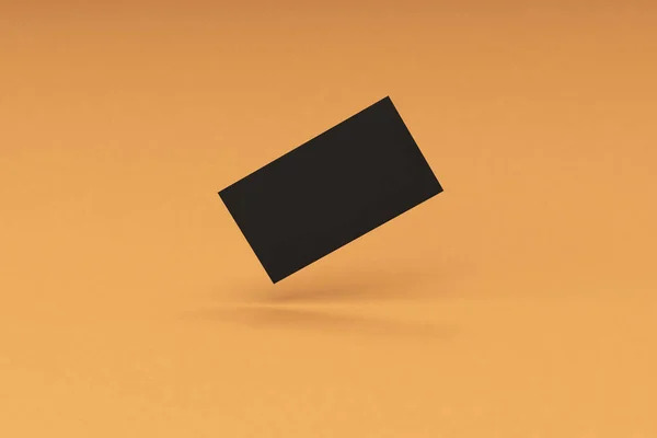 Modello di biglietti da visita vuoti neri su sfondo arancione — Foto Stock