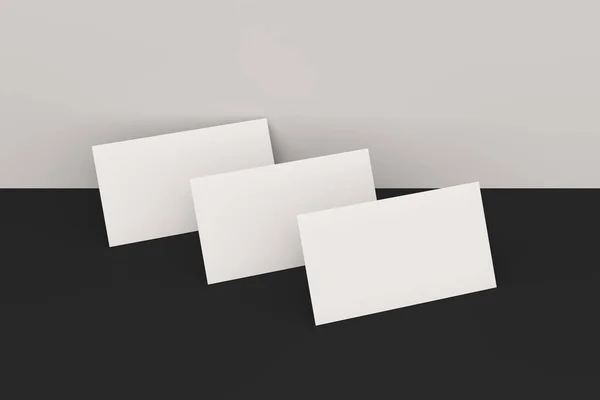 Белые чистые визитки макет на черно-белом фоне — стоковое фото
