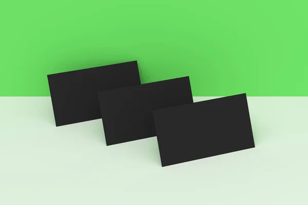 Чорні порожні візитки глузують на зеленому та білому тлі — стокове фото