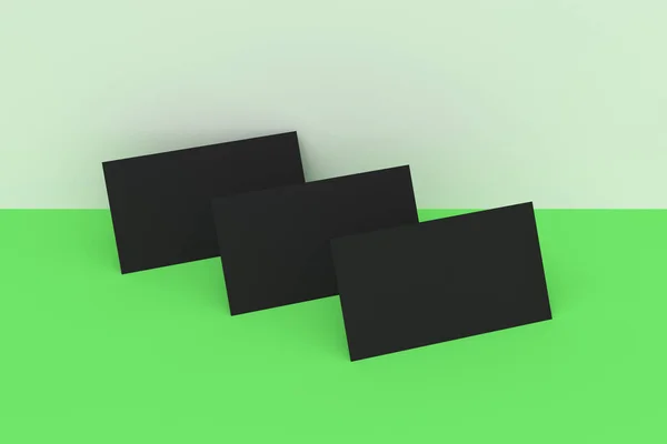 Чорні порожні візитки глузують на зеленому та білому тлі — стокове фото