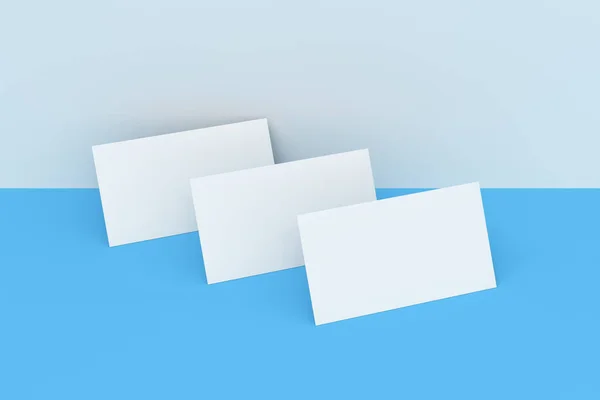 Beyaz ve mavi zemin üzerine beyaz boş kartvizit mock-up — Stok fotoğraf