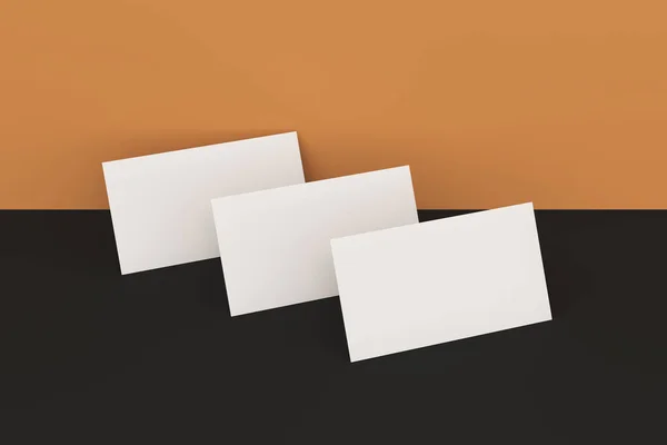 Білі порожні візитки глузують на чорно-помаранчевому фоні — стокове фото