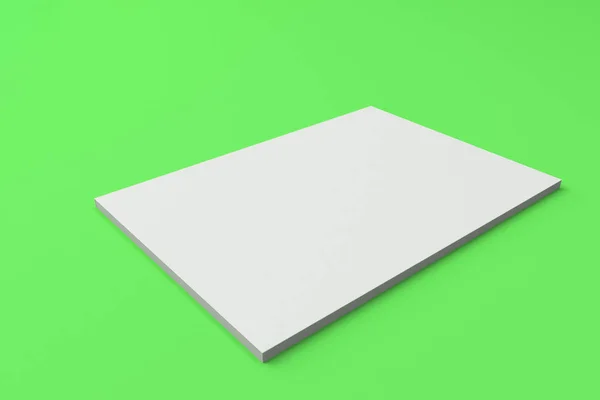 Mock-up de brochura branca fechada em branco sobre fundo verde — Fotografia de Stock