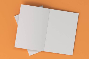 İki boş beyaz açık broşür mock-up turuncu zemin üzerine