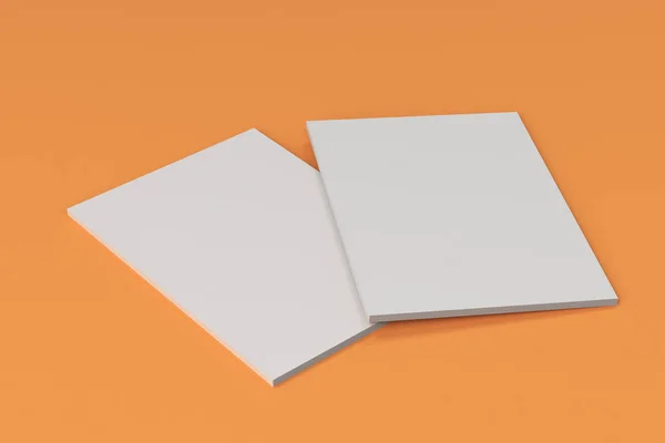 Two blank white closed brochure mock-up on orange background — Stock Photo, Image