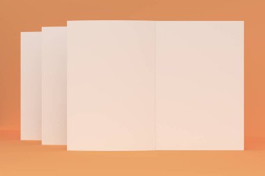 Üç boş beyaz açık broşür mock-up turuncu zemin üzerine