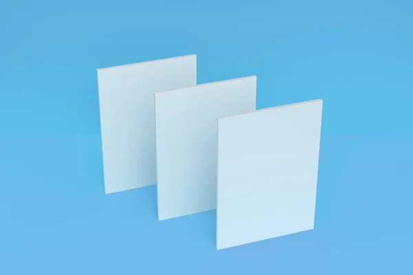 Drie lege witte gesloten brochure mock-up op blauwe achtergrond — Stockfoto
