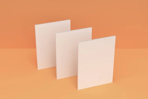 Tres blanco en blanco folleto cerrado maqueta sobre fondo naranja —  Fotos de Stock