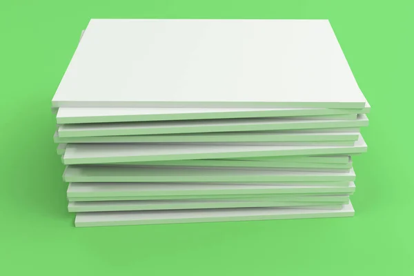 Stack of blank white closed brochure mock-up on green background — Stock Photo, Image