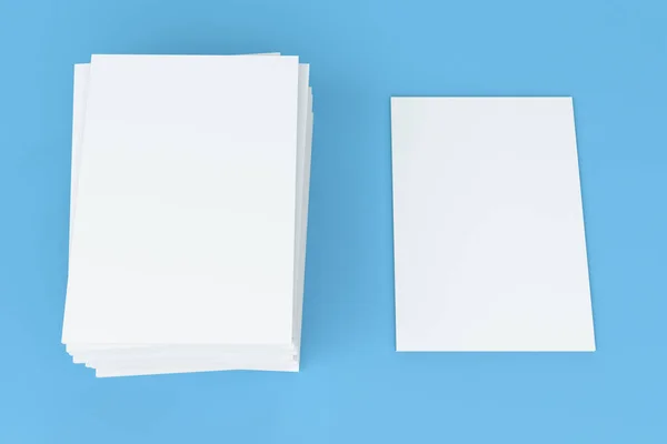 Stack of blank white closed brochure mock-up on blue background — Stock Photo, Image