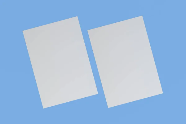 İki boş beyaz el ilanları mockup mavi zemin üzerine — Stok fotoğraf