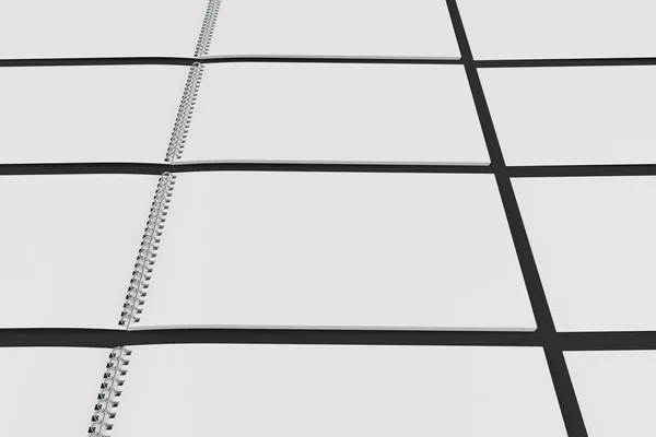 Порожній білий блокнот з металевою спіраллю, прив'язаною до чорного фону — стокове фото